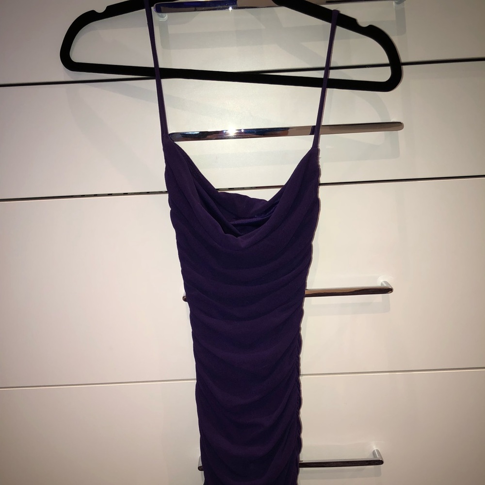 Purple tight dress.